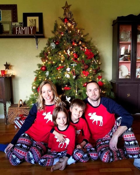 Family in matching holiday pajamas