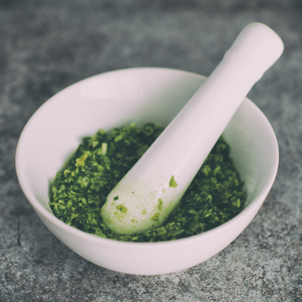 mortar and pestle with pesto