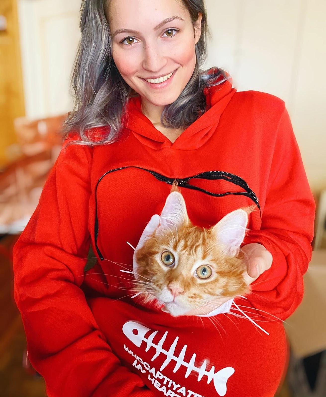 Hoodie that lets you carry store your cat